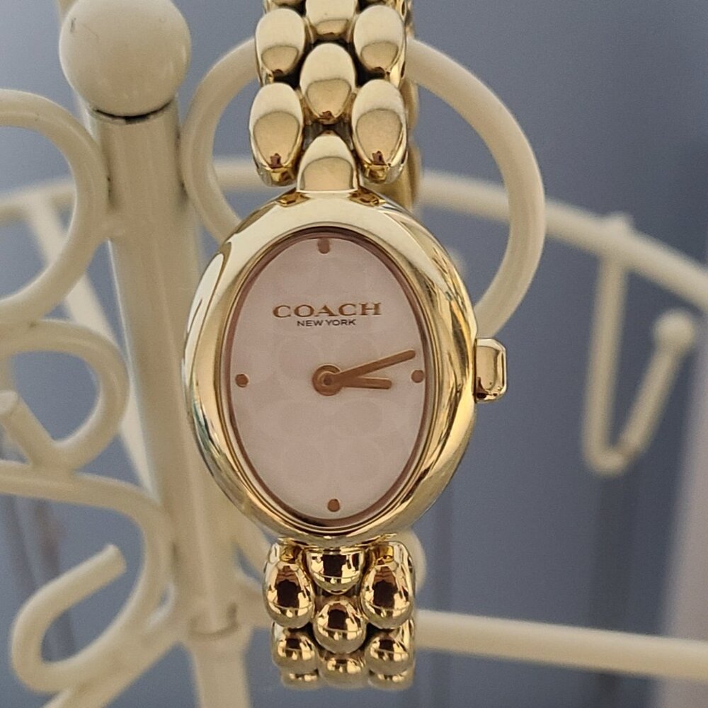 Coach Gold-Tone Oval Bracelet Watch with Pink Mother-of-Pearl Dial